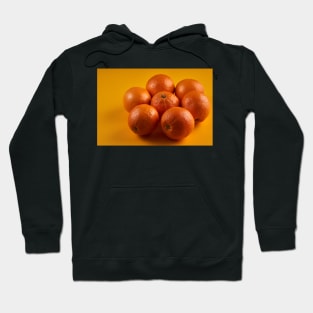 Oranges on a yellow background Hoodie